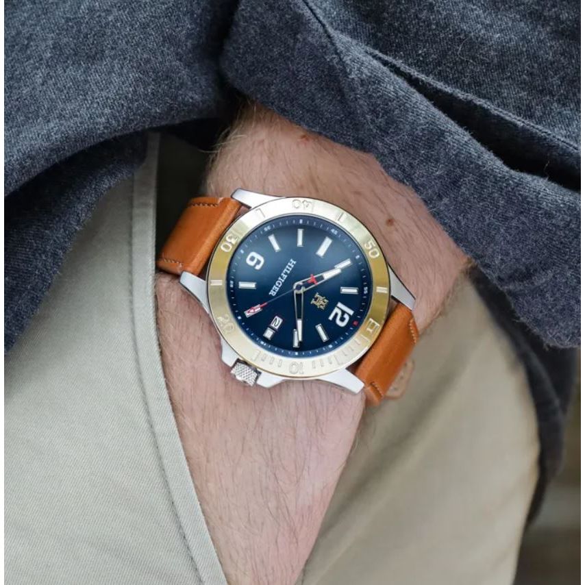 Alt Tag: TOMMY HILFIGER Mod. 1710529 quartz analog watch with 46mm case, mineral dial, 5 ATM water resistance. Brown bracelet on wrist.
