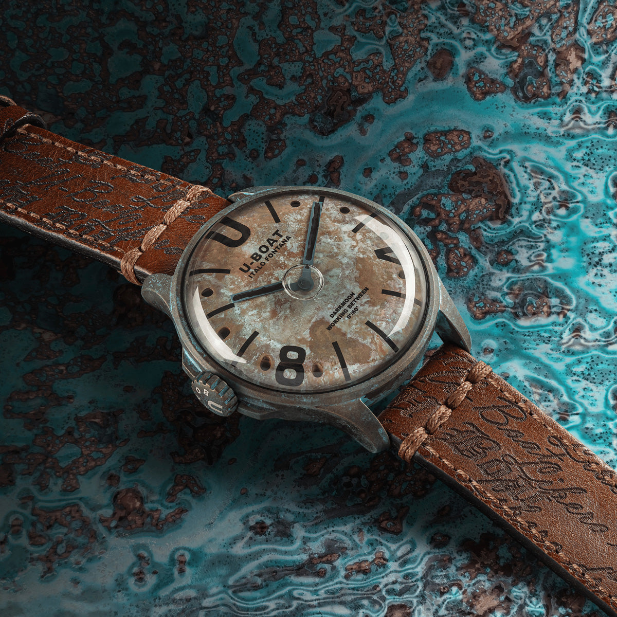 U-BOAT WATCHES Mod. 9600/A with brown leather strap on textured blue background