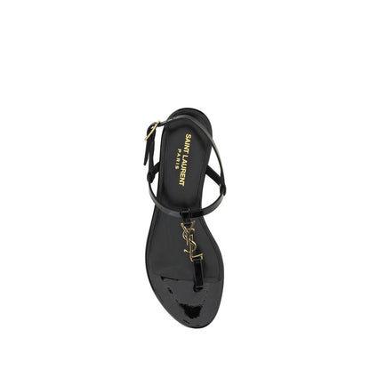 Alt Tag: Saint Laurent Black Calf Leather Bos Taurus Flat Sandals with ankle strap and embossed monogram top view.