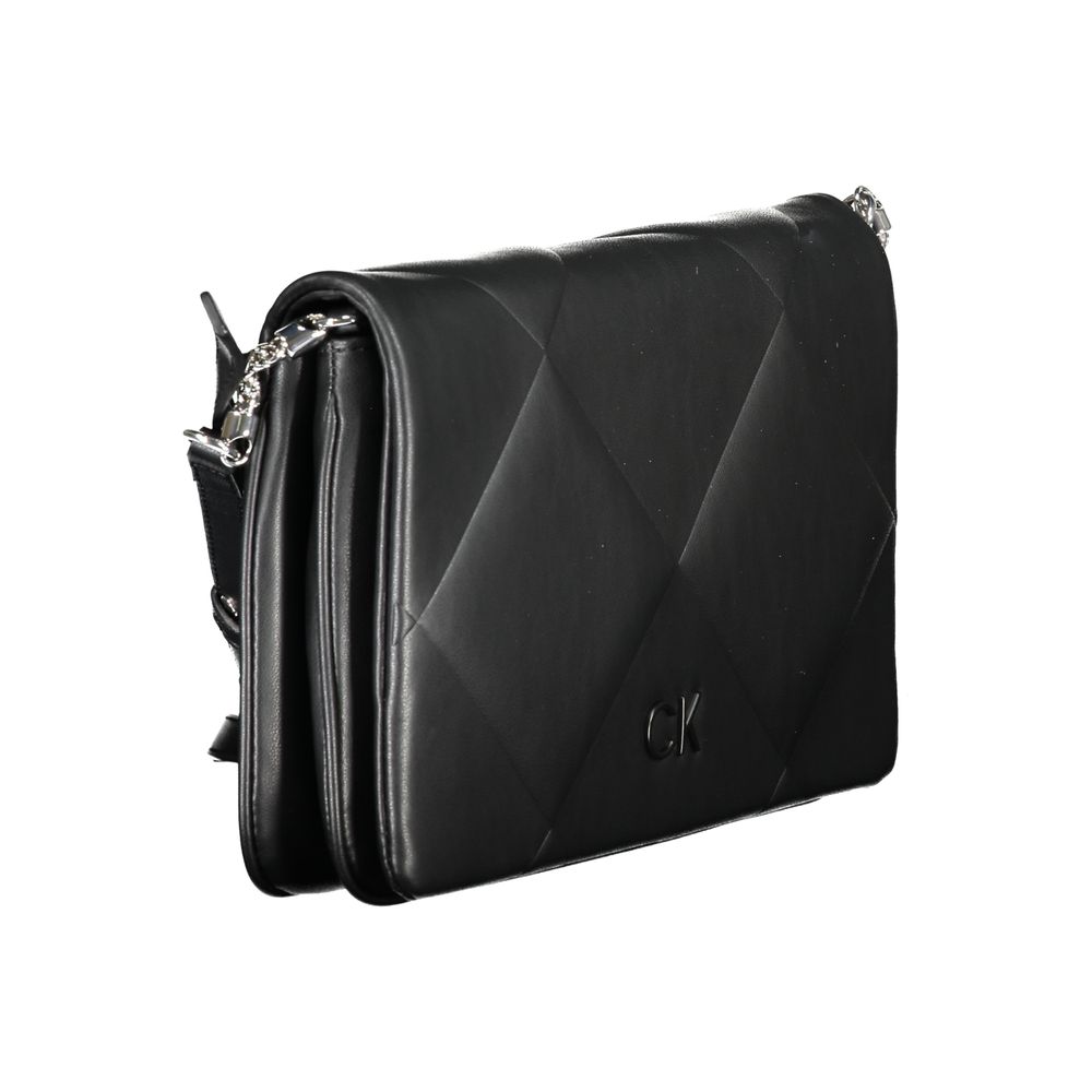 Calvin Klein Black Cotton Handbag with adjustable strap, two compartments, logo, snap closure, and contrasting details.