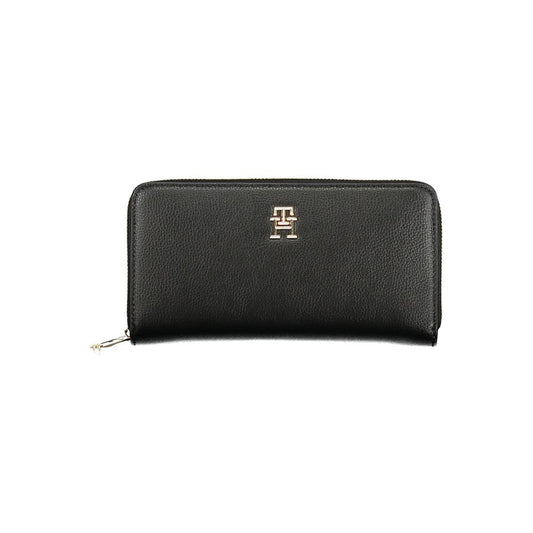Tommy Hilfiger Black Polyethylene Women Wallet with zip closure and logo, featuring multiple compartments for cards and cash.