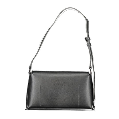 Calvin Klein Black Polyester Handbag with adjustable shoulder handle, internal pocket, and snap closure.