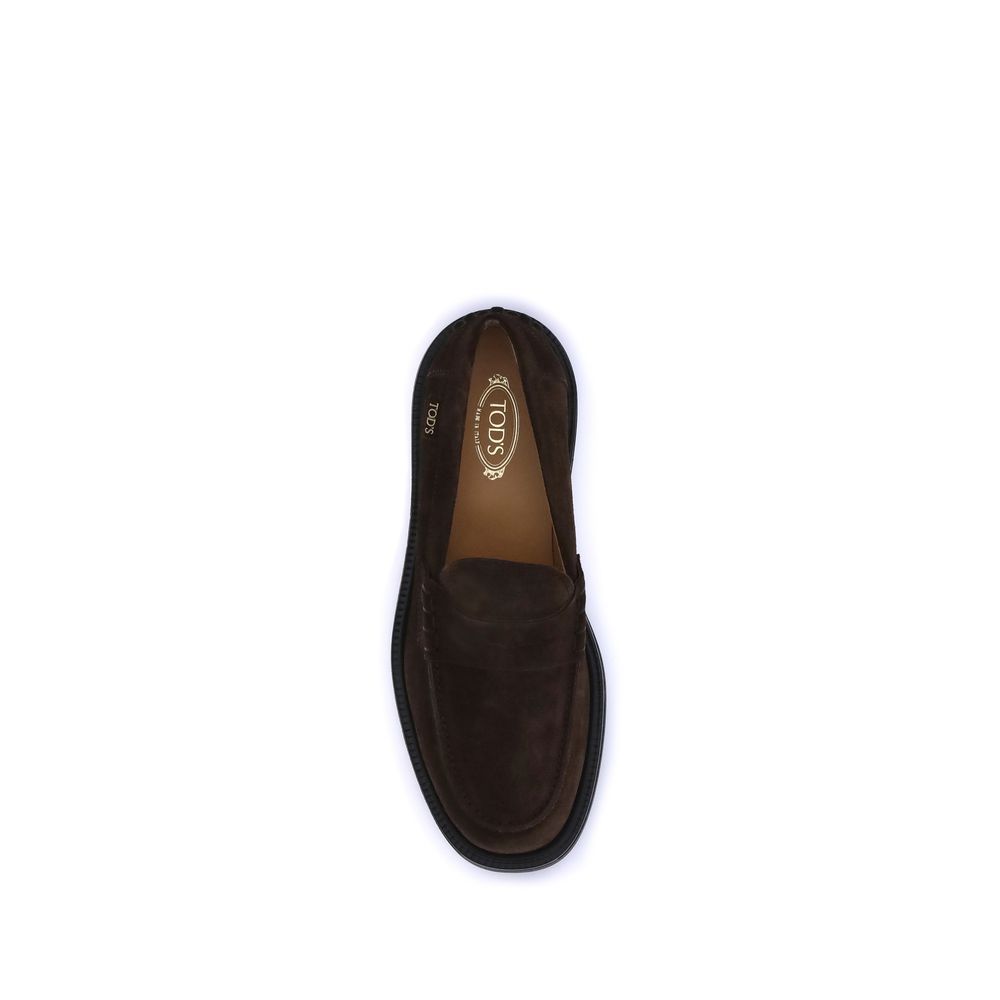 Top view of Tod's Brown Rubber Slip-On Loafers with visible hand-stitched vamp and rubber sole, showcasing elegance and craftsmanship.