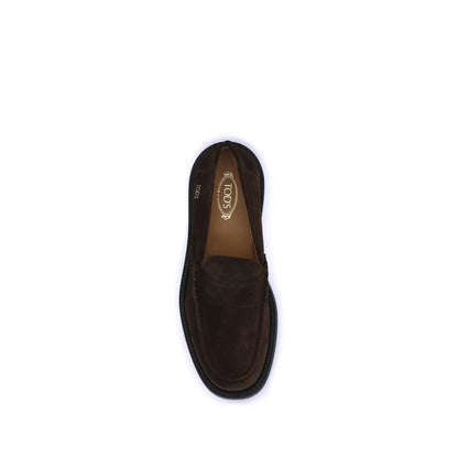 Top view of Tod's Brown Rubber Slip-On Loafers with visible hand-stitched vamp and rubber sole, showcasing elegance and craftsmanship.