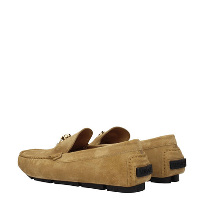 Versace Beige Leather Slip-On Loafers with front logo, round toe, and low flat heel in suede and leather.