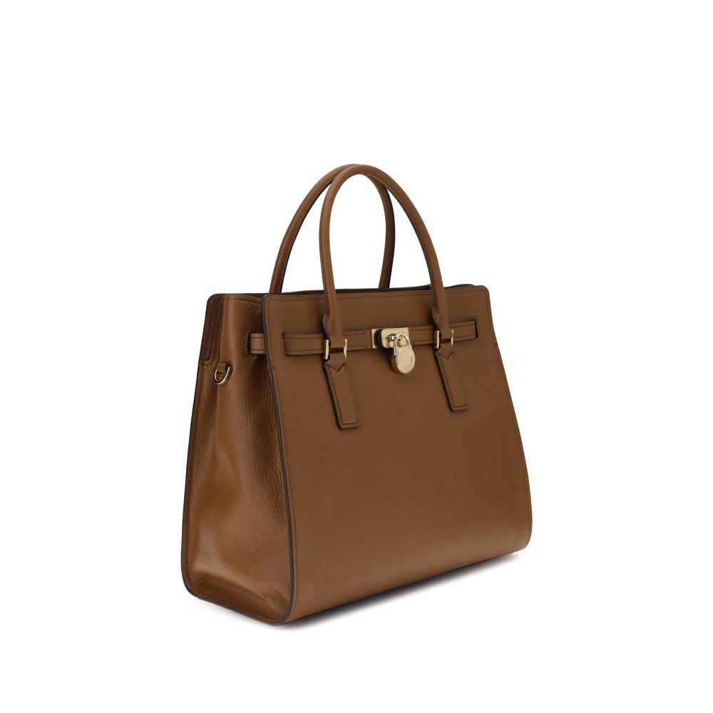 Elegant brown leather handbag with top handles and a lock accent, featuring a classic and sophisticated design for versatile use.