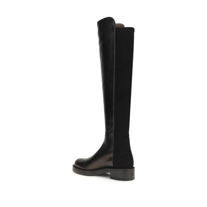 Stuart Weitzman Black Leather Over The Knee boot with block heel and elastic back for a snug fit, elegant design for versatile wear.