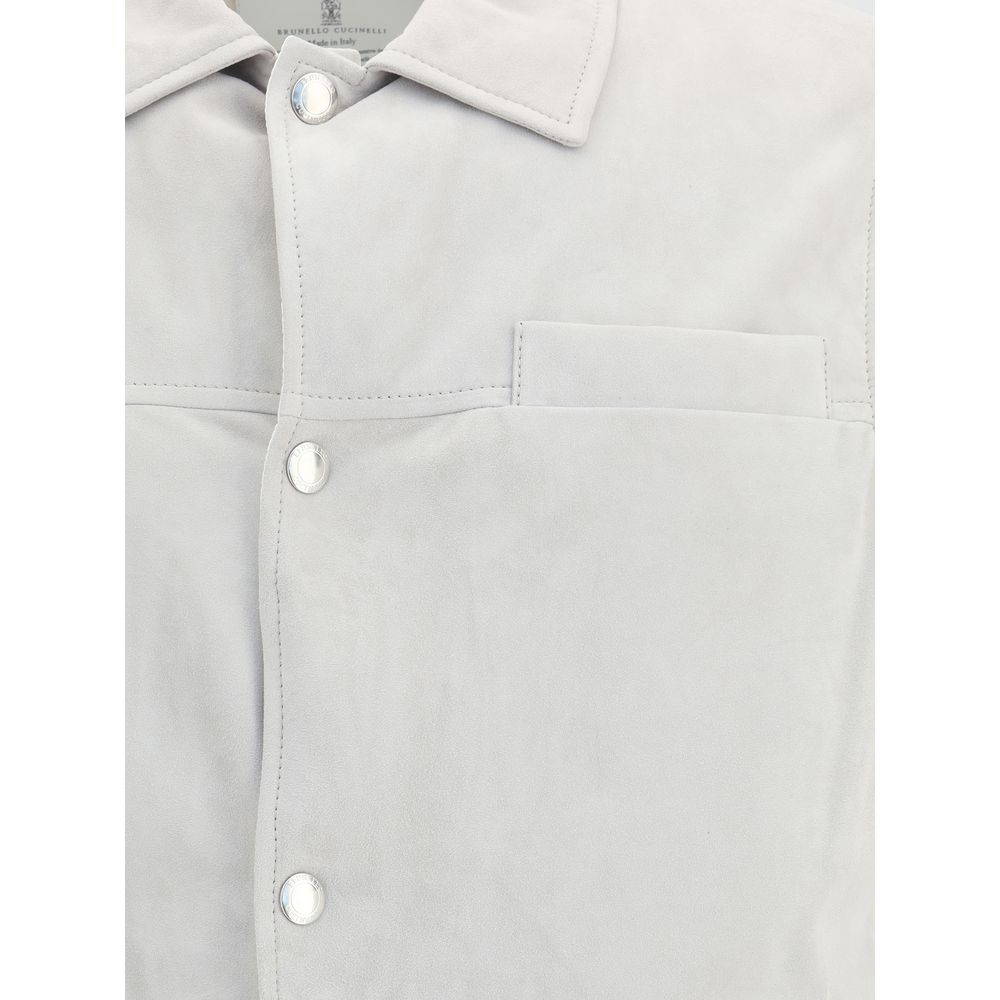 Close-up of Brunello Cucinelli Gray Leather Jacket with snap buttons and breast pocket, highlighting elegant design and soft leather texture.