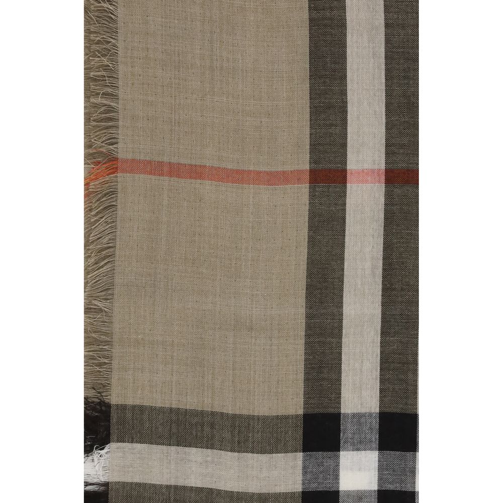 Close-up of Burberry Beige Wool Scarf featuring distinctive check print in sand and brown tones with fringed edges, made in Italy.