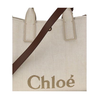 Chloé Beige Cotton Shoulder Bag with signature tote design and adjustable brown strap, showcasing elegance and practicality.