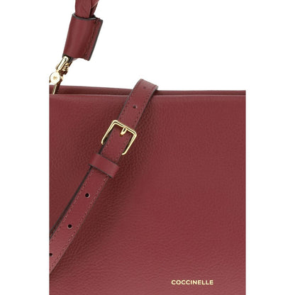 Coccinelle Bordeaux Calf Leather Bos Taurus Shoulder Bag with adjustable strap and garnet leather close-up.