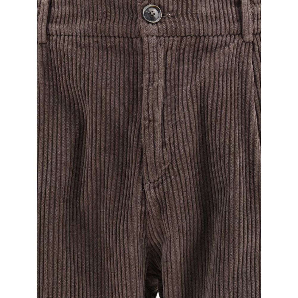 Close-up of Cruna Brown Cotton Casual Pants with corduroy texture and button closure for a refined casual look, 100% cotton material.