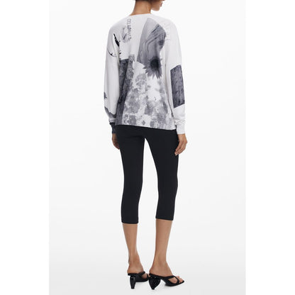 Back view of model wearing Desigual White Viscose Women Sweater with artistic patterns and black leggings.