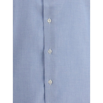 Close-up of Finamore Light Blue Cotton Dress Shirt with button detailing, made from fine cotton and cashmere blend.