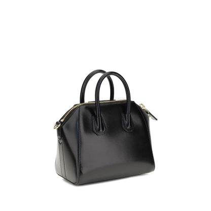 Givenchy Black Calf Leather Bos Taurus Handbag with geometric pattern, dual handles, and detachable strap; iconic monogram on front.
