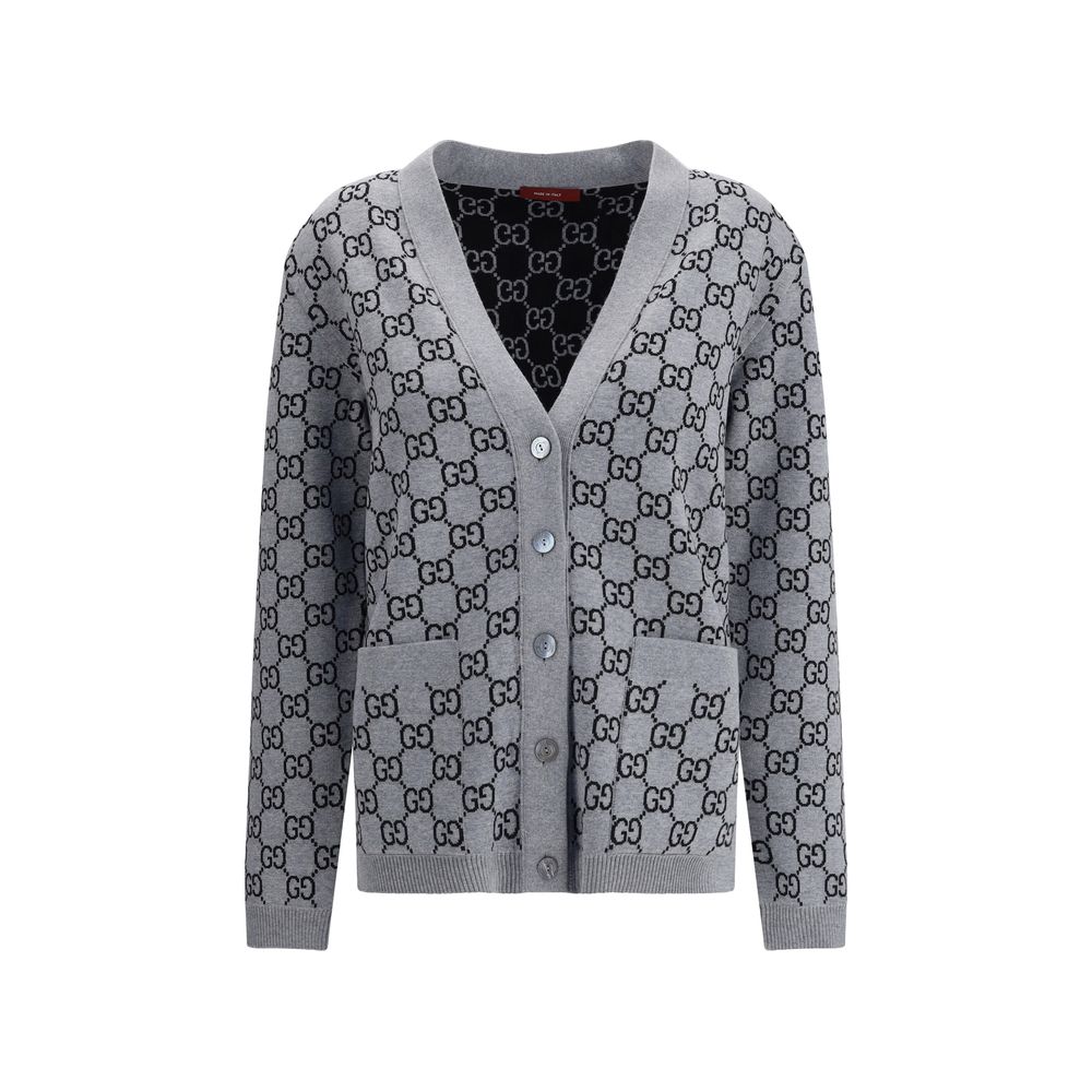 Gucci Black Wool Cardigan with GG Supreme reversible pattern, V-neckline, front pockets, and ribbed trim in black and white.