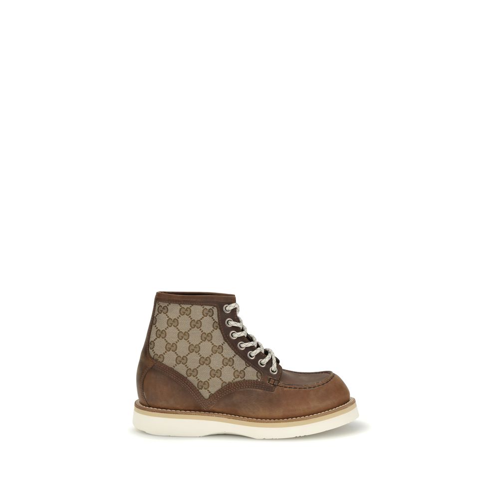 Gucci Brown Leather Lace-Up Boots with GG fabric insert, showcasing iconic design and durable Goodyear construction.
