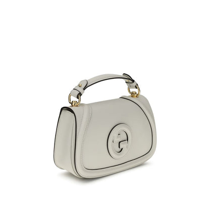 Gucci White Calf Leather Bos Taurus Handbag with tonal GG applique, flat handle, adjustable strap, magnetic closure, back pocket.