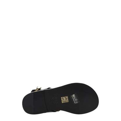 Isabel Marant Black Leather Flip-Flop Sandals with gold studs, open toe, buckle closure, low heel, and leather sole, bottom view.