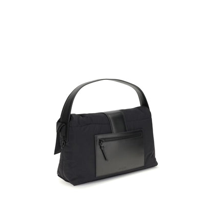 Jacquemus Black Nylon Shoulder Bag with leather handle, magnetic flap, zipper closure, and adjustable grosgrain strap, side view.