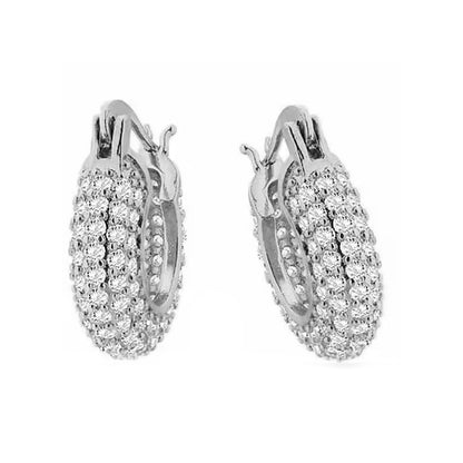 Elegant silver hoop earrings with intricate diamond detailing, perfect for adding sparkle to any outfit.