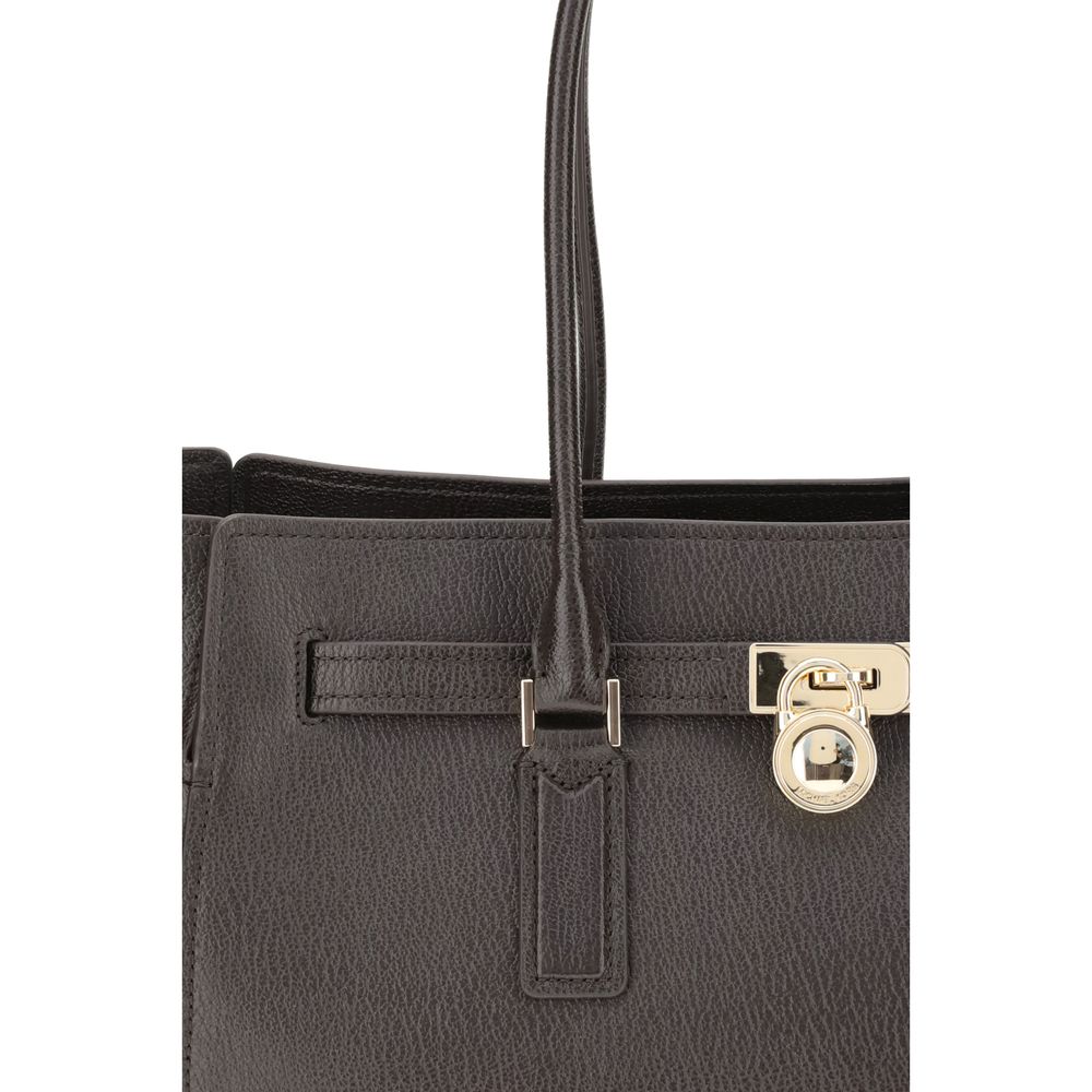 Michael Kors Brown Calf Leather Bos Taurus Shoulder Bag with decorative belt and iconic padlock pendant, close-up view.