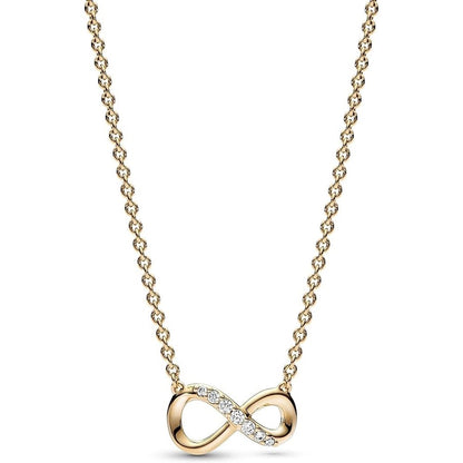 Gold infinity necklace with diamond accents on a chain, elegant jewelry piece for women.