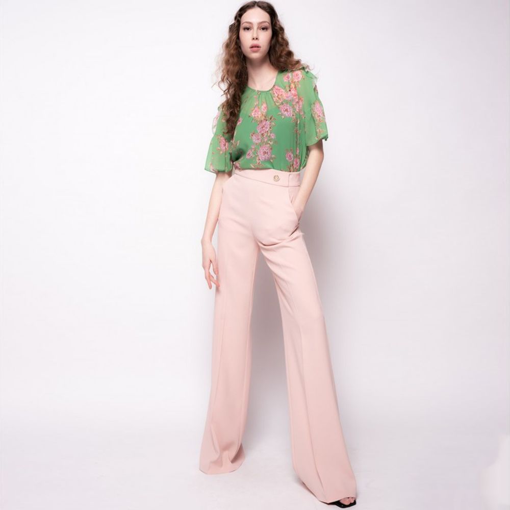 Model wearing PINKO Pink Polyester Women's Trouser, showing high waist and avant-garde leg cut in a stylish pose.