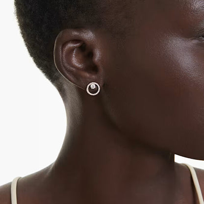 Close-up of SWAROVSKI Mod. 5692263 earrings worn by a model, showcasing elegant crystal design and sparkling finish.