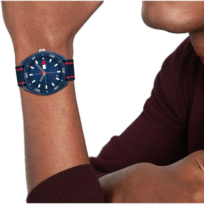 Unisex TOMMY HILFIGER Mod. 1792069 quartz analog watch with navy strap, mineral dial, and 44mm case, displayed on wrist.