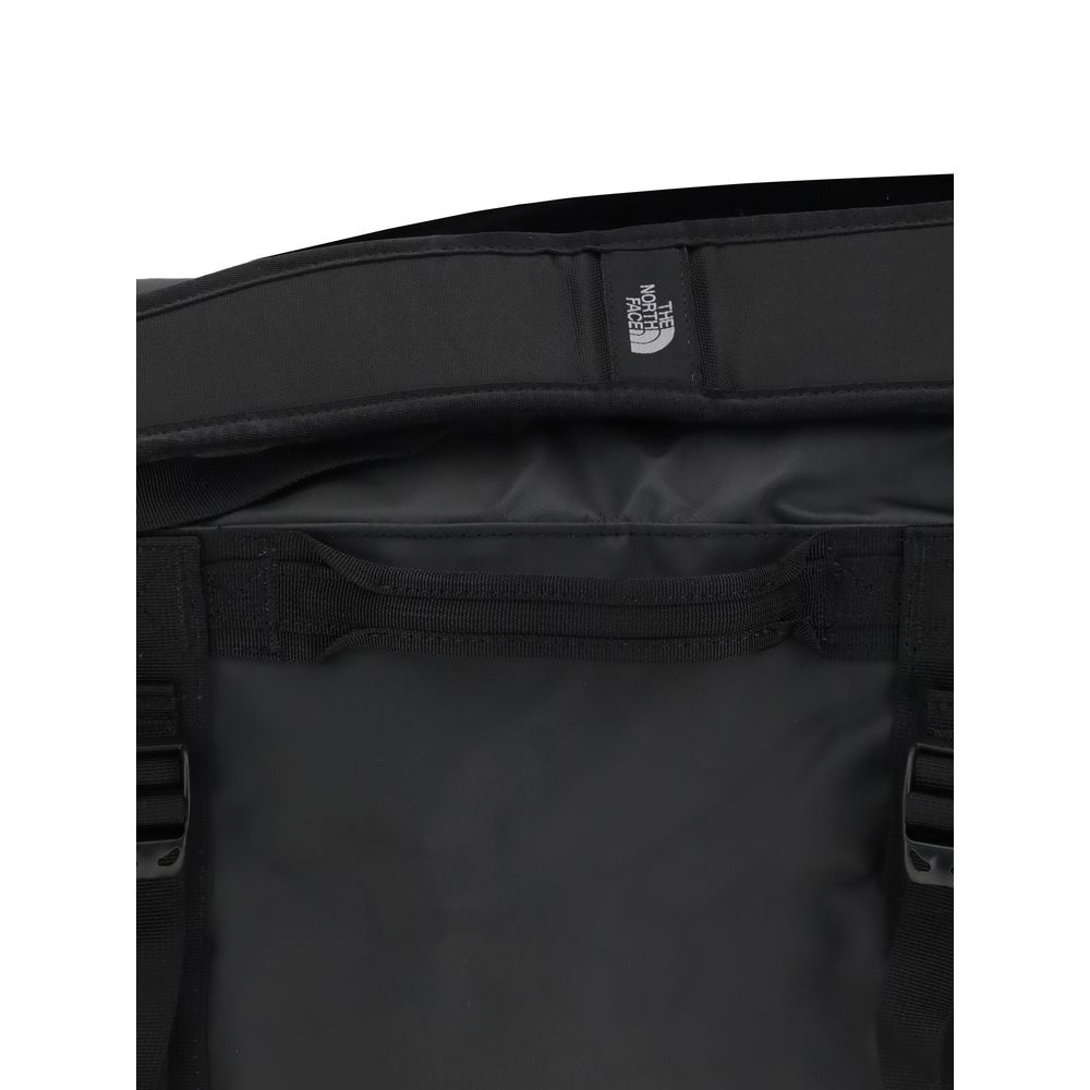 The North Face Black Nylon Luggage And Travel duffel bag interior view showing padded handles and waterproof material.