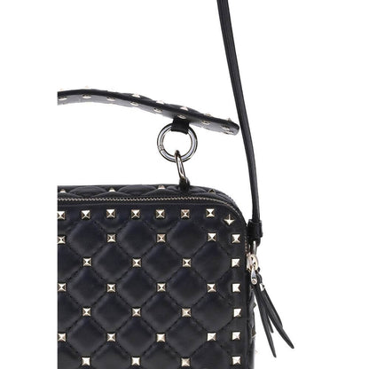 Valentino Garavani Black Lamb Ovis Aries Aries Shoulder Bag with gold-tone Rockstud studs and removable leather handle detail.