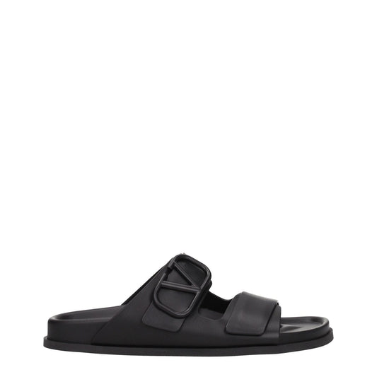 Valentino Garavani Black Leather Slippers with open toe and front logo, featuring a low flat heel and rubber sole, MPN S0G80UHE0NO.
