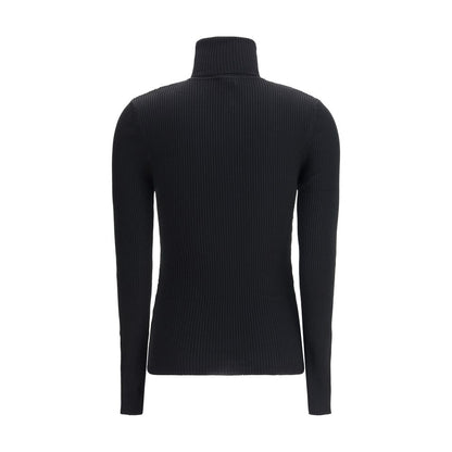Back view of Wolford Black Fleece Wool Turtleneck with ribbed design and slim fit silhouette, showcasing elegant long sleeves and turn-up collar.